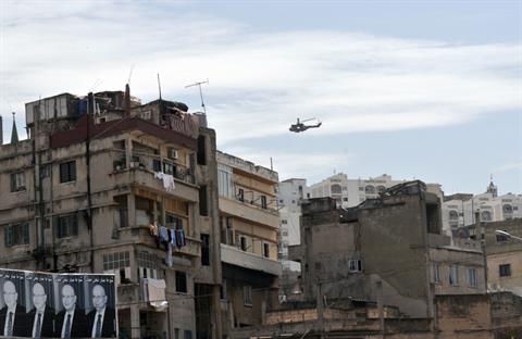 A helicopter from the Lebanese armed forces hovers during the army security plan in Tripoli, April 1, 2014. AFP PHOTO/IBRAHIM CHALHOUB