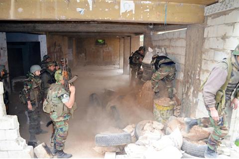 Lebanese soldiers remove barricades and sand bags during raids in Tripoli, Tuesday, April 1, 2014. (The Daily Star/Lebanese Army Website, HO)
