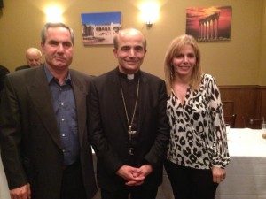 Roger and Randa Naddaf pose with Bishop A. Elias Zaidan.