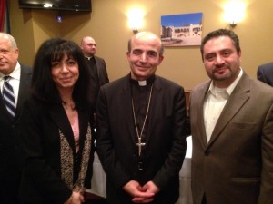 Elie and Marlene Tohme pose with Bishop A. Elias Zaidan.