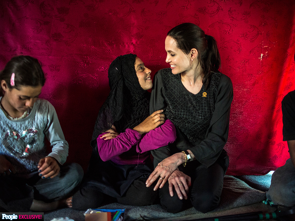 Angelina Jolie meets with Hala, a 12-year-old Syrian refugee living in the Bekaa Valley in Lebanon. (Photo via PEOPLE Magazine/Bryan Denton)