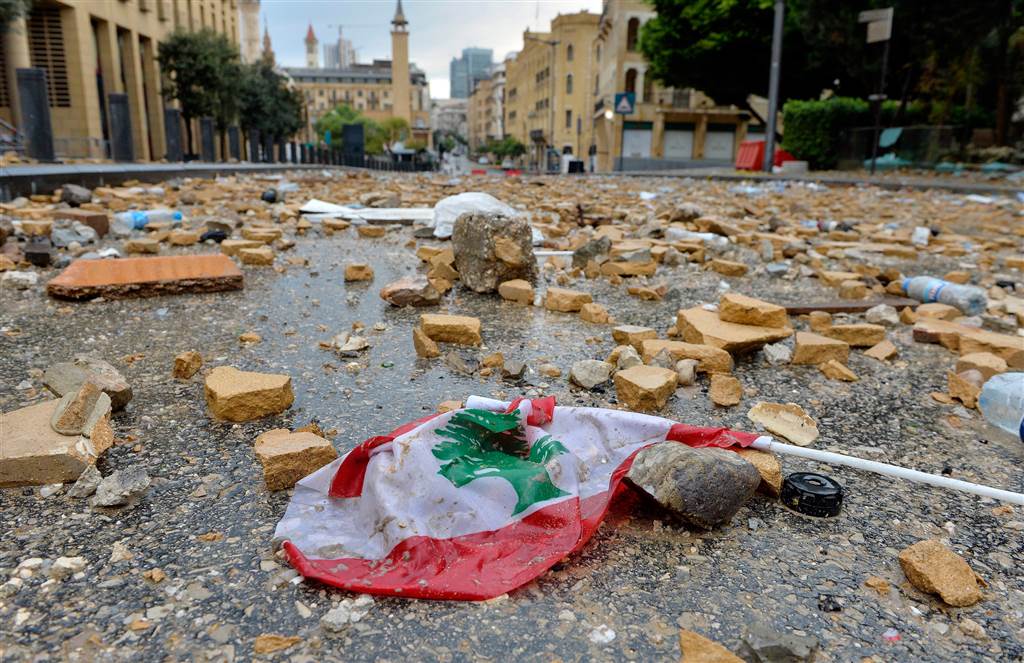 Stones which were hurled at the site of clashes between Lebanese activists and riot police fill the street leading to the parliament building. (Wael Hamzeh/EPA)