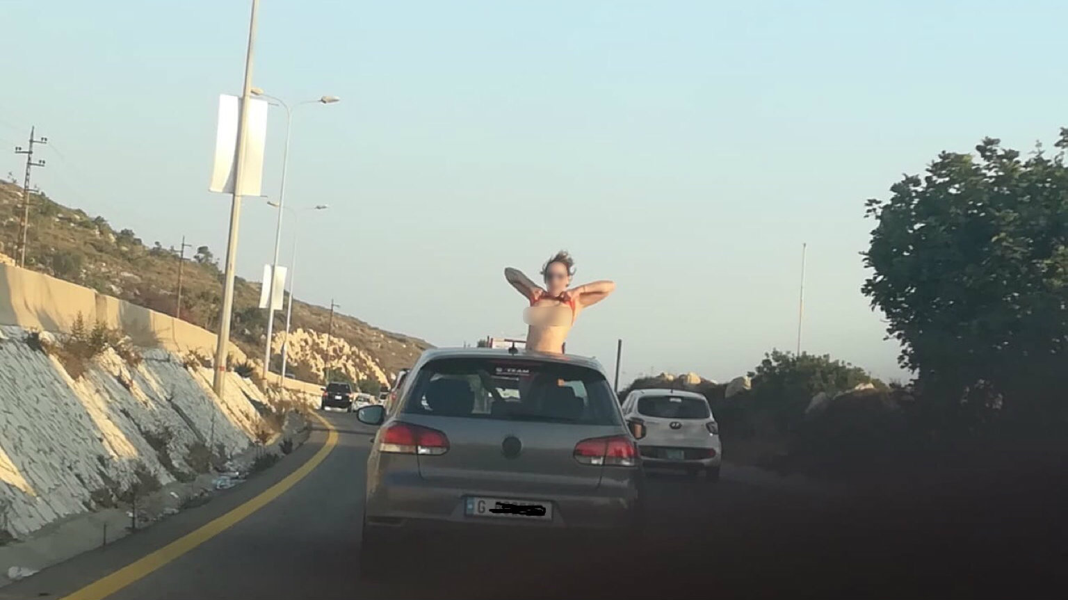 Lebanese police ing for topless, flashing woman on highway